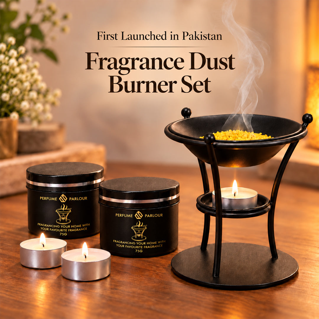 Fragrance dust burner set with two black metal tin containers labeled Perfume Parlour, a black metal incense burner stand with yellow incense and rising smoke, and three lit tealight candles on a wooden table. Text at the top reads 'First Launched in Pakistan' and 'Fragrance Dust Burner Set'.